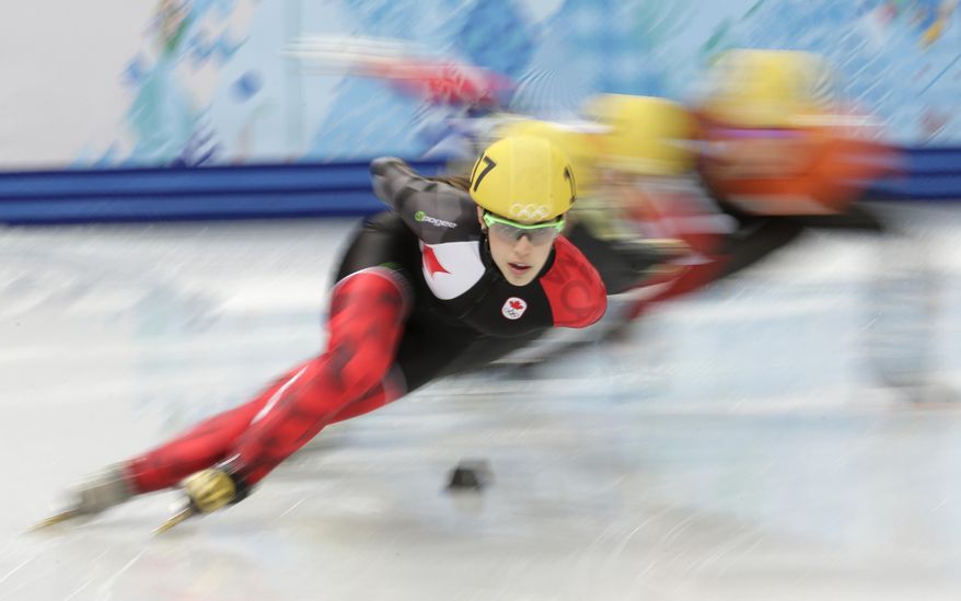 FILE - This Feb. 21, 2014 file photo shows Valerie Maltais of Canada competing in a women's 1000m short track speedskating quarterfinal at the Iceberg Skating Palace during the 2014 Winter Olympics in Sochi, Russia. NBC says it worked with Olympic officials to stop some 45,000 instances of illegally posted video or pirate streams that surfaced to show competition during the Sochi games. (AP Photo/Bernat Armangue, File)