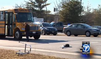 Elia Miranski&#39;s walker is seen at the Columbia Pike/Tech Road intersection in Silver Spring, Md. Miranski, a 91-year-old Holocaust survivor, died Wednesday afternoon after being hit by a school bus. (WJLA)