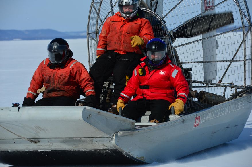 In this photo taken on Thursday, Feb. 27, 2014, U.S. Army Corps of Engineers use airboats to travel along the Lake Pepin section of the Mississippi River near Wabasha, Minn., to survey the thinkness of the ice covering the ricer. The survey, the first one of the year, is part of the Corps’ task of maintaining and monitoring the river’s navigation system, which is vital to the Upper Midwest’s economy. The weekly results are tracked by river shippers eager to get to work for the new season. (AP Photo/The Star Tribune, Richard.Sennot) MANDATORY CREDIT; ST. PAUL PIONEER PRESS OUT; MAGS OUT; TWIN CITIES TV OUT