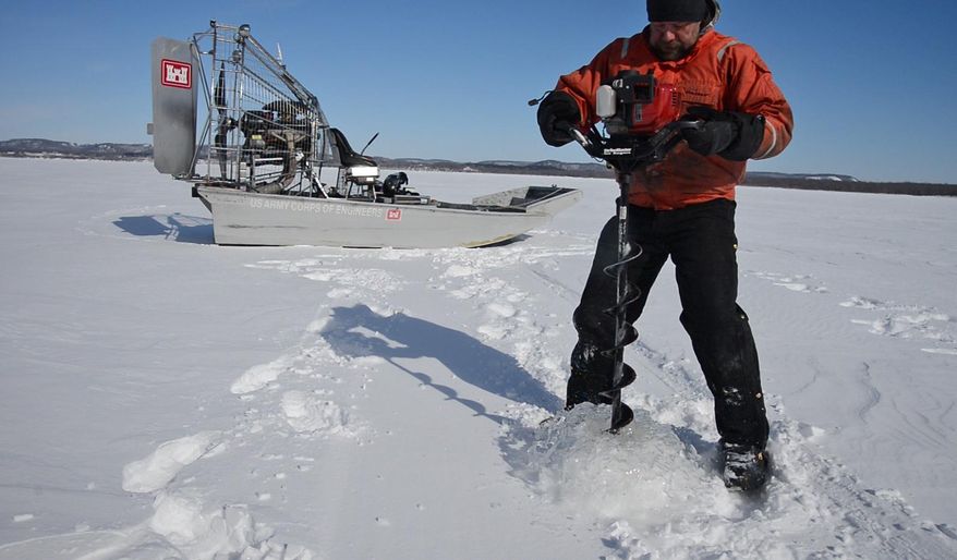 In this photo taken on Thursday, Feb. 27, 2014, Bill Chelmowski, of the US Army Corps of Engineers, drills a hole to measure the depth of the ice covering the Lake Pepin section of the Mississippi River near Wabasha, Minn. The survey, the first one of the year, is part of the Corps’ task of maintaining and monitoring the river’s navigation system, which is vital to the Upper Midwest’s economy. The weekly results are tracked by river shippers eager to get to work for the new season. (AP Photo/The Star Tribune, Richard.Sennot) MANDATORY CREDIT; ST. PAUL PIONEER PRESS OUT; MAGS OUT; TWIN CITIES TV OUT