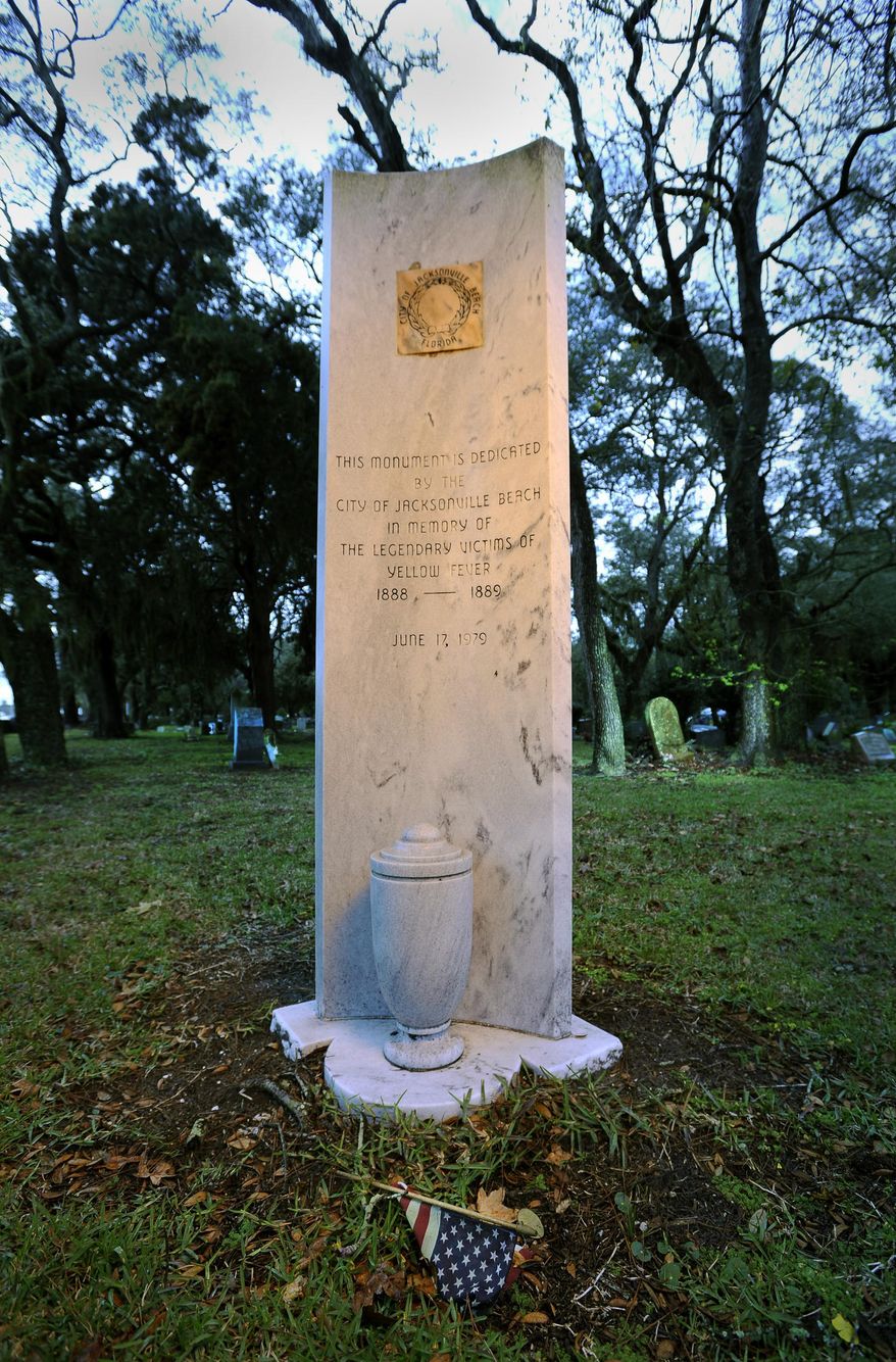 FOR RELEASE SATURDAY, MARCH 1, 2014, AT 1:52 A.M. EST - In this Feb. 21, 2014 photo, a monument memorializing the Yellow Fever victims of 1888-1889 stands in a corner of the H. Warren Smith Cemetery at the intersection of Beach Blvd. and Penman Road in Jacksonville Beach, Fla. It’s been more than a century since the state’s worst yellow fever epidemic swept through Jacksonville, killing about 450 people and infecting about 4,700 more. The outbreak was so bad it prompted nearly every city in the South to ban Jacksonville residents from seeking refuge. (AP Photo/The Florida Times-Union, Bob Self)