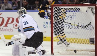 San Jose Sharks goaltender Antti Neimi (31), of Finland, is scored on by Buffalo Sabres&#39; Cody Hodgson, not seen, as Sabres left winger Matt Moulson (26) watches during the first period of an NHL hockey game in Buffalo, N.Y., Friday, Feb. 28,  2014. (AP Photo/Gary Wiepert)