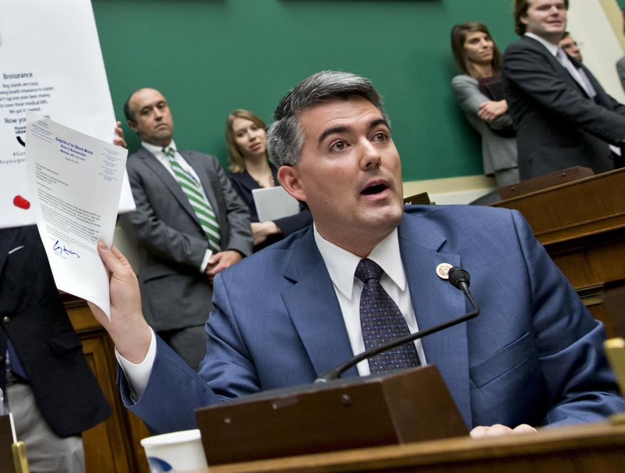 Rep. Cory Gardner, Colorado Republican, holds up a letter he wrote to Health and Human Services Secretary Kathleen Sebelius asking that she consider waiving Obamacare for the 4th Congressional District of Colorado, as she testified on Capitol Hill in Washington Oct. 30, 2013. (Associated Press) **FILE**