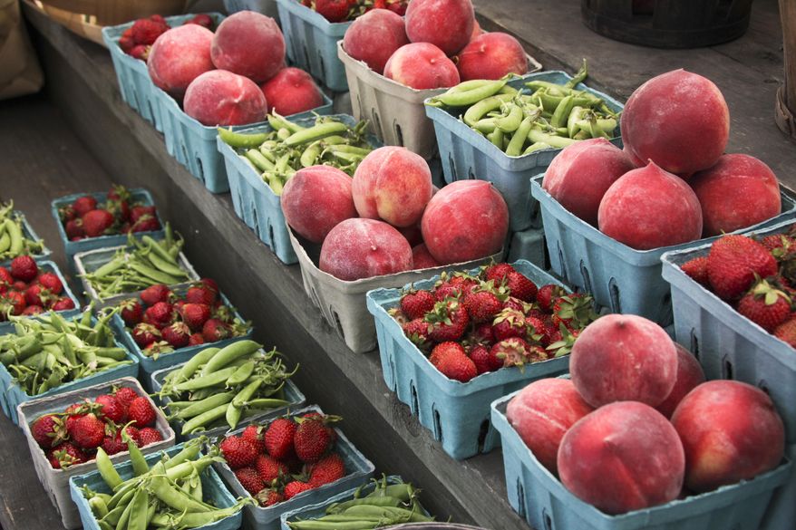 Peaches, strawberries, and snap peas at a roadside market. "Eat a wide variety of whole, natural foods (those unaltered by man)," advises Dr. Angela Griffiths. (AP Photo/J. Scott Applewhite)