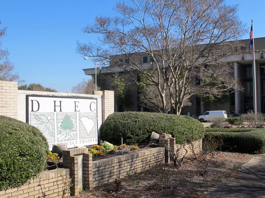 The headquarters of the South Carolina Department of Health and Environmental Control, or DHEC, in Columbia., S.C. is seen on Thursday, Feb. 27, 2014. The South Carolina Supreme Court will hear arguments on March 6, 2014 over whether the agency can end a program regulating the building or expansion of medical facilities in the state. The agency suspended the Certificate of Need program last year after Gov. Nikki Haley vetoed $1.7 million needed to run the program. (AP Photo/Bruce Smith)