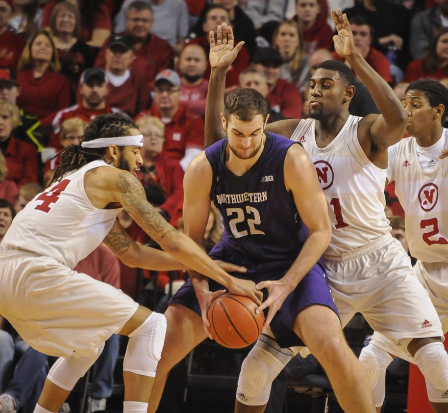Nebraska's Terran Petteway (44) knocks the ball away from Northwestern center Alex Olah (22) during an NCAA college basketball game Saturday, March 1, 2014, in Lincoln, Neb. (AP Photo/Dave Weaver)