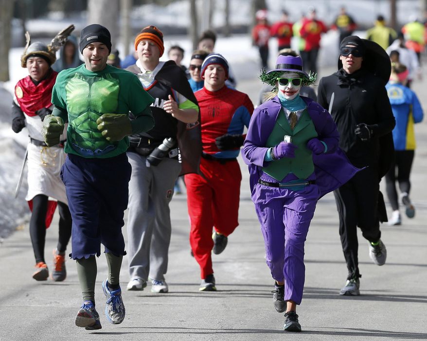 Runners in costume train for the Boston Marathon in Newton, Mass., Saturday, March 1, 2014. People running this year's Boston Marathon for charity gathered for a 17-mile training run along the last 17 miles of the course. (AP Photo/Michael Dwyer)