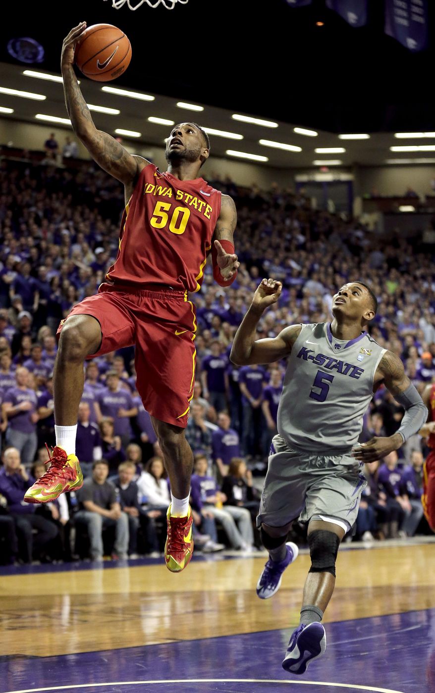 Iowa State's DeAndre Kane (50) gets past Kansas State's Jevon Thomas (5) to put up a shot during the first half of an NCAA college basketball game Saturday, March 1, 2014, in Manhattan, Kan. (AP Photo/Charlie Riedel)