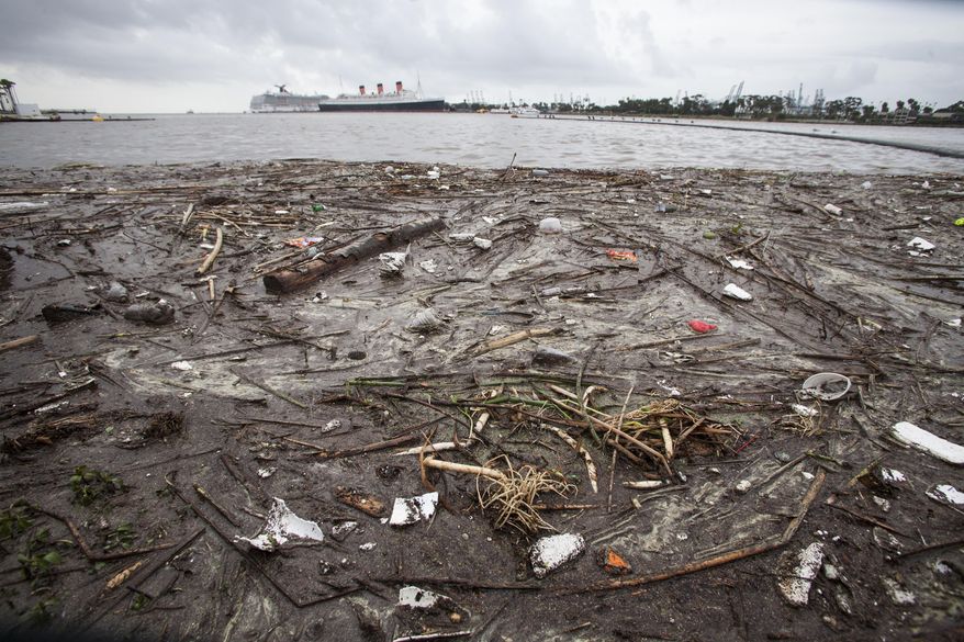 Trash collects along the shore after after a rainstorm in Long Beach, Calif. on Saturday, March 1, 2014. Evacuation orders remained in effect for hundreds of homes in Los Angeles County foothill communities where fires have burned away vegetation that holds soil in place, and bursts of rain caused the mountains to belch occasional debris flows. (AP Photo/Ringo H.W. Chiu)