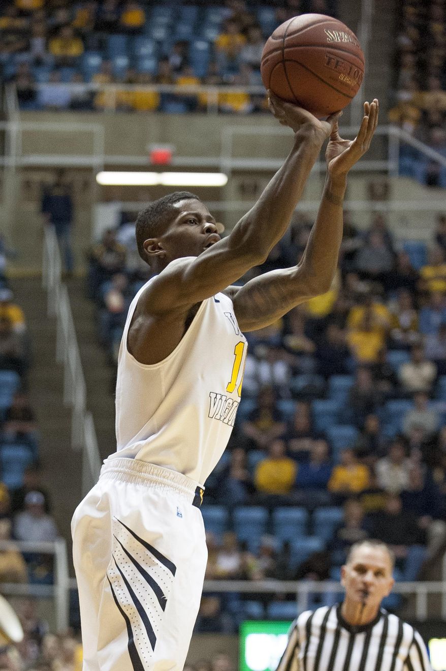 West Virginia's Eron Harris (10) looks to shoot during the first half of an NCAA college basketball game against TCU, Saturday, March 1, 2014, in Morgantown, W.Va. (AP Photo/Andrew Ferguson)