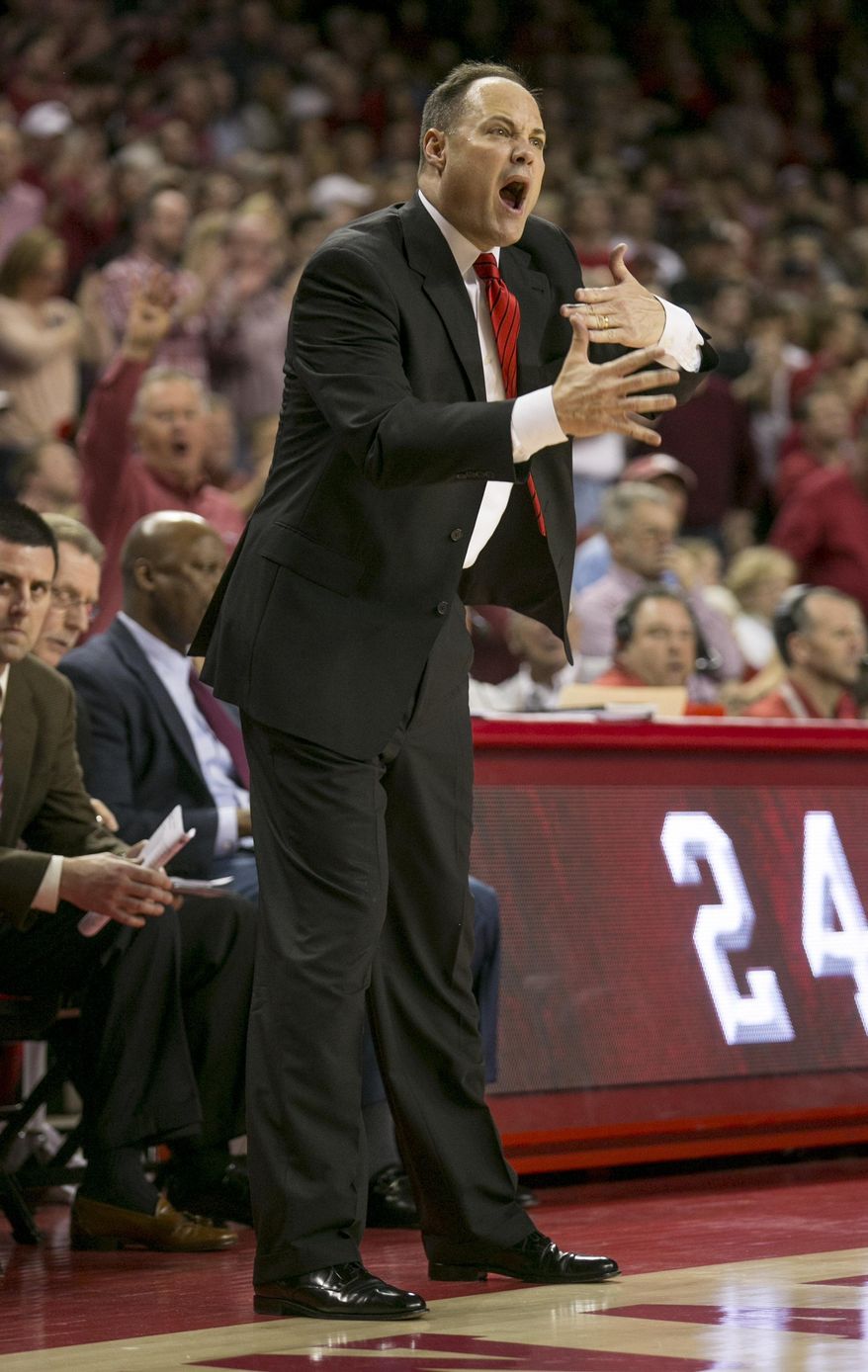 Georgia head coach Frank Martin yells at the referee about a foul call during the first half of an NCAA college basketball game against Arkansas on Saturday, March 1, 2014, in Fayetteville, Ark. (AP Photo/Gareth Patterson)