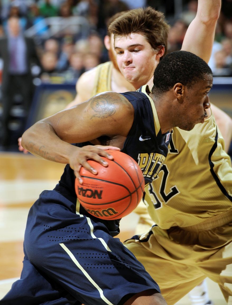 Pittsburgh guard Lamar Patterson drives the lane as Notre Dame guard Steve Vasturia defends in the second half of an NCAA college basketball game Saturday, March 1, 2014 in South Bend, Ind. Pittsburgh won 85-81 in overtime with Patterson scoring 20 points. (AP Photo/Joe Raymond)