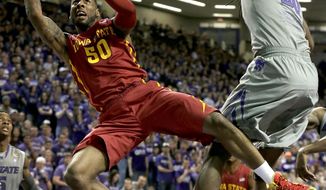 Iowa State&#x27;s DeAndre Kane (50) gets past Kansas State&#x27;s D.J. Johnson, right, to put up a shot during the first half of an NCAA college basketball game Saturday, March 1, 2014, in Manhattan, Kan. (AP Photo/Charlie Riedel)