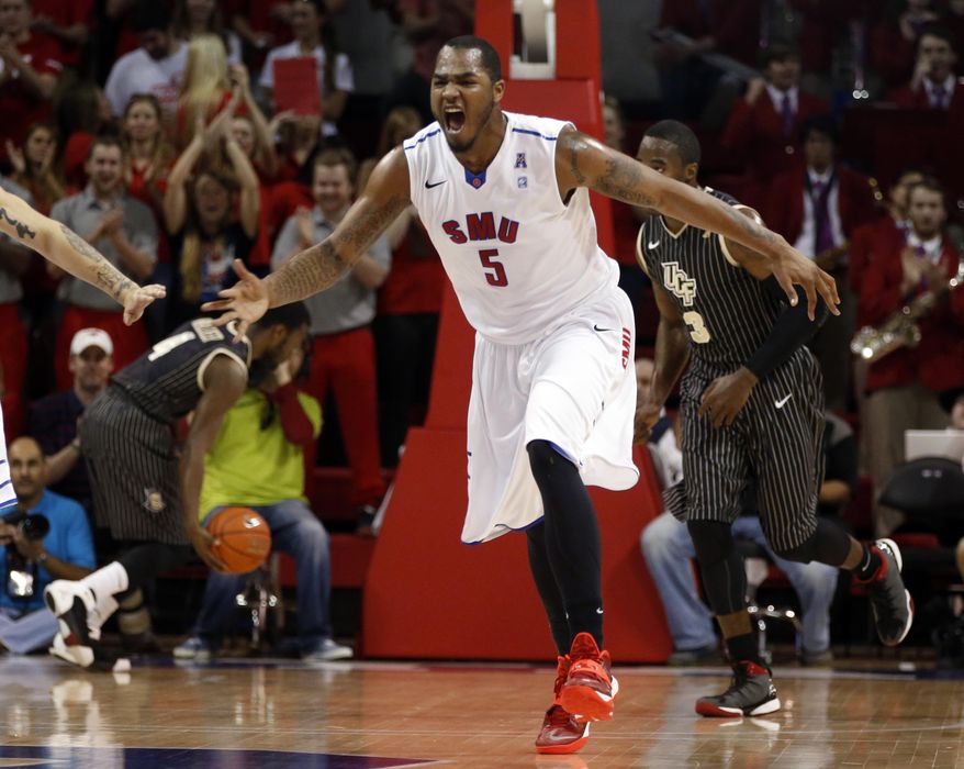 SMU forward Markus Kennedy (5) shouts after slam-dunking a ball during the first half of an NCAA college basketball game against Central Florida, Saturday, March 1, 2014, in Dallas. (AP Photo/John F. Rhodes)
