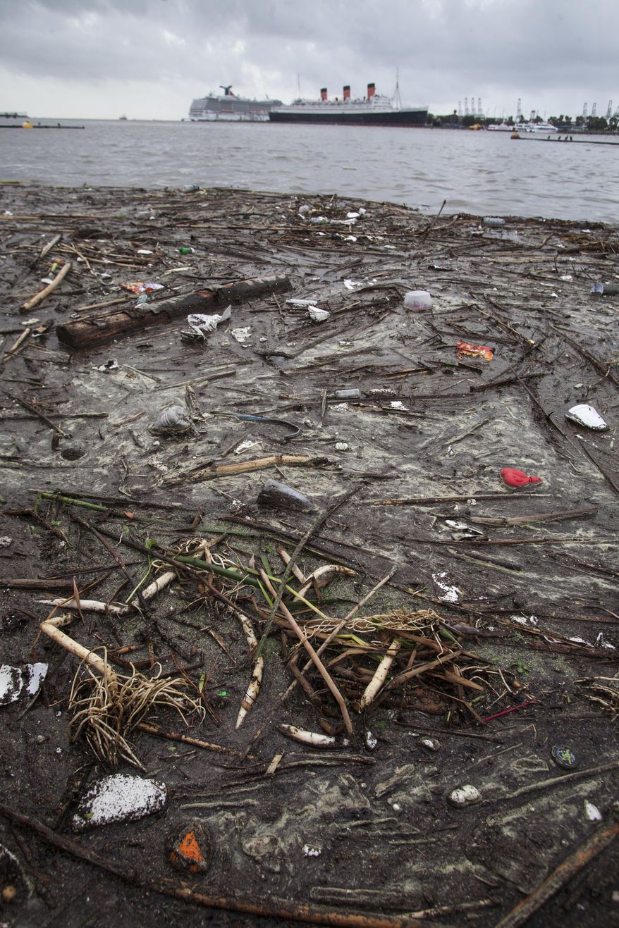 Trash collects along the shore after after a rainstorm in Long Beach, Calif. on Saturday, March 1, 2014. (AP Photo/Ringo H.W. Chiu)
