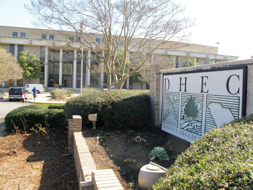 The headquarters of the South Carolina Department of Health and Environmental Control, or DHEC, in Columbia., S.C. is seen on Thursday, Feb. 27, 2014. The South Carolina Supreme Court will hear arguments on March 6, 2014 over whether the agency can end a program regulating the building or expansion of medical facilities in the state. The agency suspended the Certificate of Need program last year after Gov. Nikki Haley vetoed $1.7 million needed to run the program. (AP Photo/Bruce Smith)
