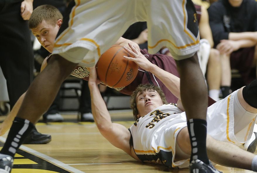 Wichita State's Evan Wessel, bottom right, scrambles for a loose ball against Missouri State's Austin Ruder, bottom left, during the first half of an NCAA college basketball game in Wichita, Kan., Saturday, March 1, 2014. (AP Photo/The Wichita Eagle, Travis Heying) LOCAL TV OUT; MAGS OUT; LOCAL RADIO OUT; LOCAL INTERNET OUT