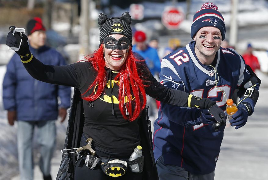 Runners in costume train for the Boston Marathon in Newton, Mass., Saturday, March 1, 2014. People running this year's Boston Marathon for charity gathered for a 17-mile training run along the last 17 miles of the course. (AP Photo/Michael Dwyer)