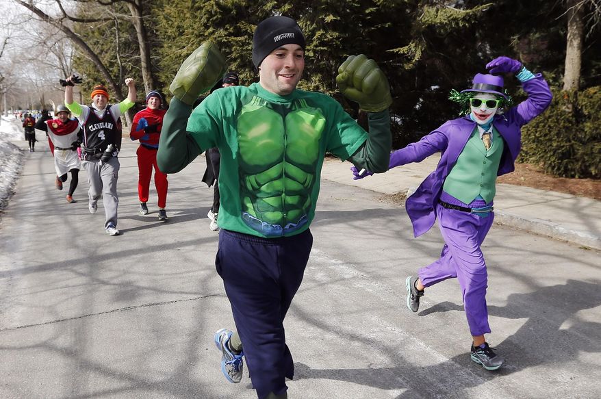 Runners in costume train for the Boston Marathon in Newton, Mass., Saturday, March 1, 2014. People running this year's Boston Marathon for charity gathered for a 17-mile training run along the last 17 miles of the course. (AP Photo/Michael Dwyer)
