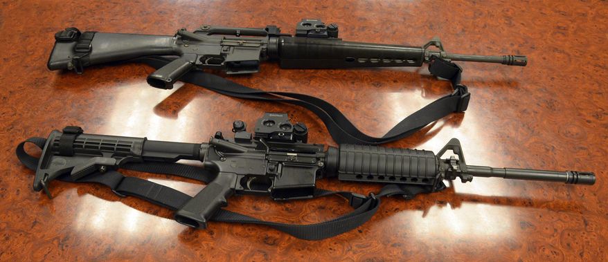 A Thursday, Feb. 20, 2014, photo shows two M-16 rifles. (AP Photo/The Salt Lake Tribune, Rick Egan) ** FILE **