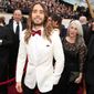 Jared Leto, center, arrives with his mother Constance and brother Shannon at the Oscars on Sunday, March 2, 2014, at the Dolby Theatre in Los Angeles.  (Photo by Matt Sayles/Invision/AP)
