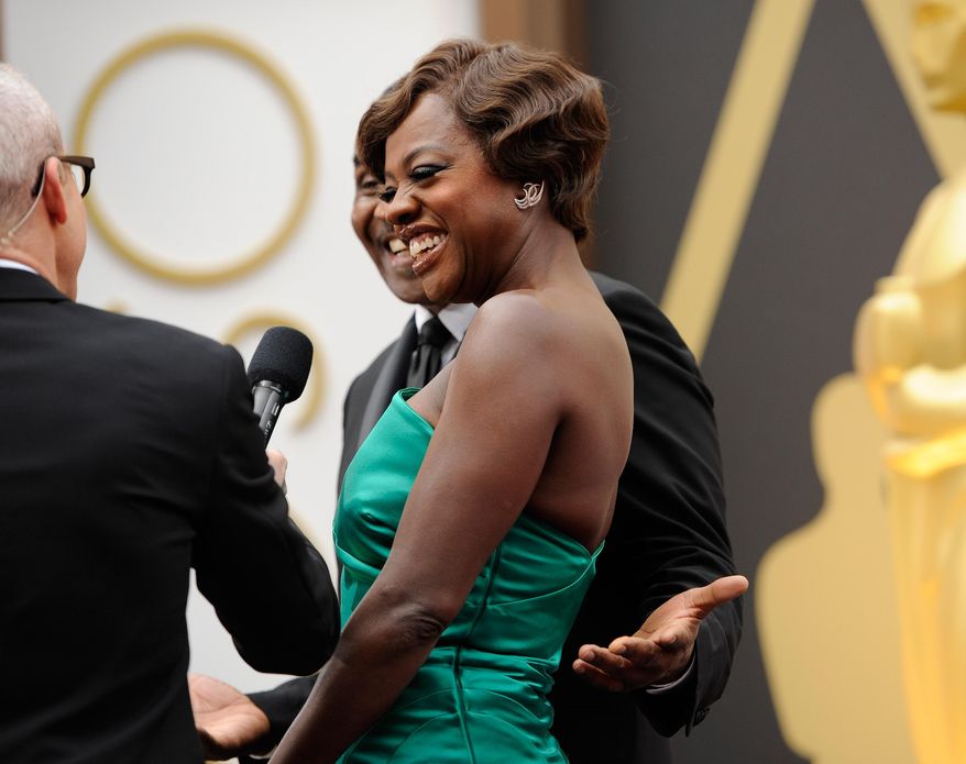 Viola Davis arrives at the Oscars on Sunday, March 2, 2014, at the Dolby Theatre in Los Angeles.  (Photo by Chris Pizzello/Invision/AP)