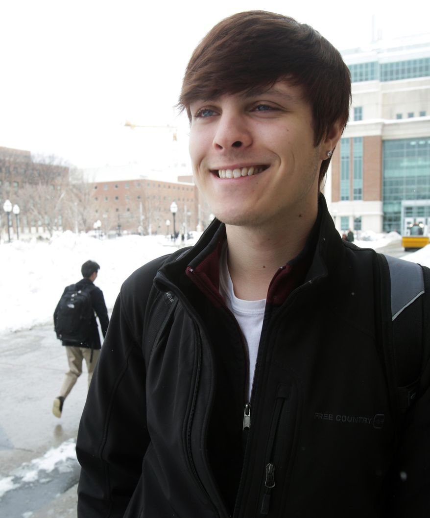 Alec Fischer, 20, poses Friday, Feb. 28, 2014, at the University of Minnesota in Minneapolis where he is a student and activist in favor of a bill at the Capitol that would compel Minnesota schools to develop ambitious policies to prevent bullying. Fischer, who grew up in Edina, said he was taunted and isolated by bullies as a middle school student and that he hopes schools can become more welcoming places for students who are seen as different. (AP Photo/Jim Mone)