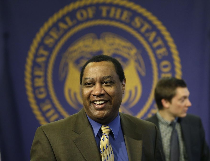 James Evans, chairman of the Utah Republican Party, looks on after a news conference announcing a deal between state legislators and the Count My Vote group over Utah's caucus-convention system on Sunday, March 2, 2014, in Salt Lake City. The deal will preserve the caucus system but allow political candidates that gather enough signatures to use an alternative path to the ballot with primary elections. (AP Photo/Rick Bowmer)