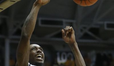 Wichita State's Nick Wiggins dunks against Missouri State during the second half of an NCAA college basketball game in Wichita, Kansas., Saturday, March 1, 2014.  (AP Photo/The Wichita Eagle, Travis Heying) LCOAL TV OUT; MAGS OUT; LOCAL RADIO OUT; LOCAL INTERNET OUT