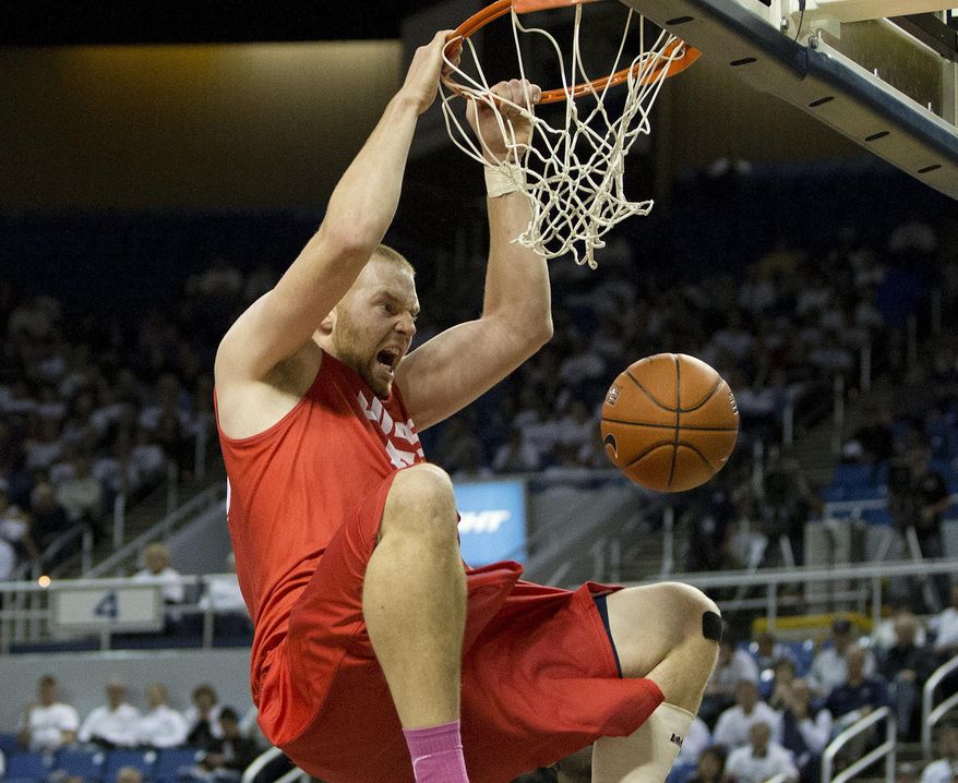 New Mexico's Alex Kirk dunks against Nevada during the first half of an NCAA college basketball game Sunday, March 2, 2014, in Reno, Nev. (AP Photo/Reno Gazette-Journal, Tom R. Smedes) CARSON CITY OUT NO SALES