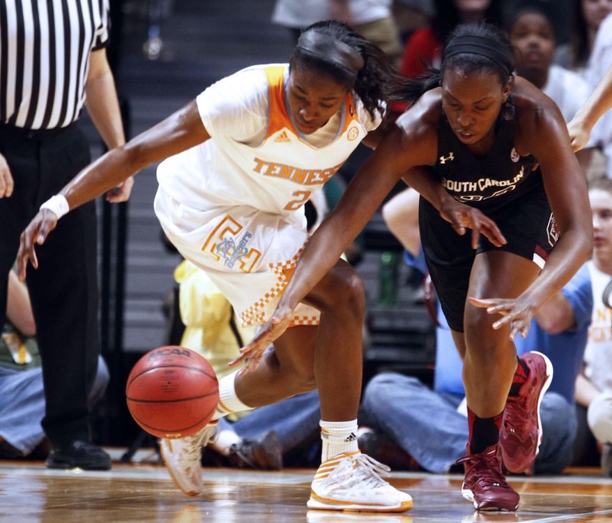 Tennessee forward Jasmine Jones (2) and South Carolina center Elem Ibiam (33) battle for a loose ball in the first half of an NCAA college basketball game on Sunday, March 2, 2014, in Knoxville, Tenn. (AP Photo/Wade Payne)