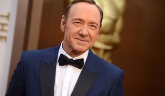 Kevin Spacey arrives at the Oscars on Sunday, March 2, 2014, at the Dolby Theatre in Los Angeles.  (Photo by Jordan Strauss/Invision/AP)