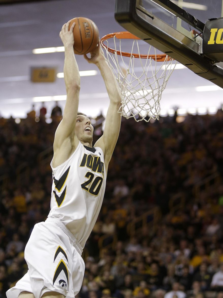 Iowa forward Jarrod Uthoff dunks during the first half of an NCAA college basketball game against Purdue, Sunday, March 2, 2014, in Iowa City, Iowa. (AP Photo/Jim Slosiarek)