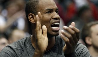 Brooklyn Nets&#x27; Jason Collins reacts from the bench in the second half of an NBA basketball game against the Milwaukee Bucks Saturday, March 1, 2014, in Milwaukee. (AP Photo/Jeffrey Phelps)