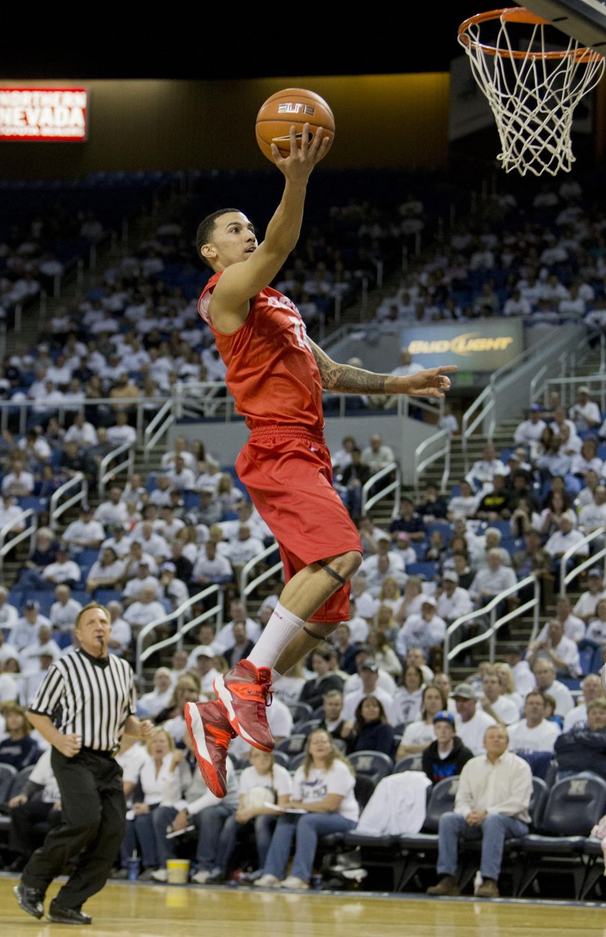 New Mexico's Kendall Williams lays the ball up on a fast break against Nevada during an NCAA college basketball game Sunday, March 2, 2014, in Reno, Nev. (AP Photo/Reno Gazette-Journal, Tom R. Smedes) CARSON CITY OUT NO SALES
