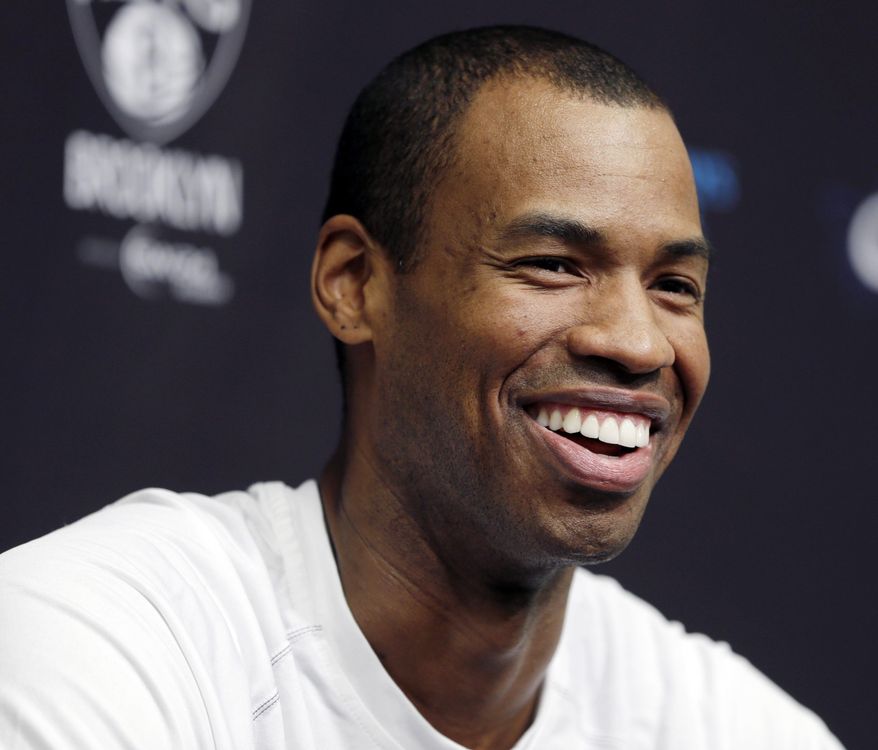 Brooklyn Nets Jason Collins speaks during a news conference before an NBA basketball game against the Chicago Bulls at the Barclays Center, Monday, March 3, 2014, in New York. More than a week after becoming the league's first openly gay player, Collins will finally get to play a home game Monday night. (AP Photo/Seth Wenig)
