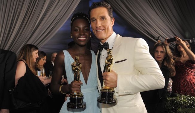 Lupita Nyong&#x27;o, winner of the award for best actress in a supporting role for &amp;quot;12 Years a Slave&amp;quot; and Matthew McConaughey winner of the award for best actor for his role in the &amp;quot;Dallas Buyers Club&amp;quot; attend the Governors Ball after the Oscars on Sunday, March 2, 2014, at the Dolby Theatre in Los Angeles.  (Photo by Chris Pizzello/Invision/AP)