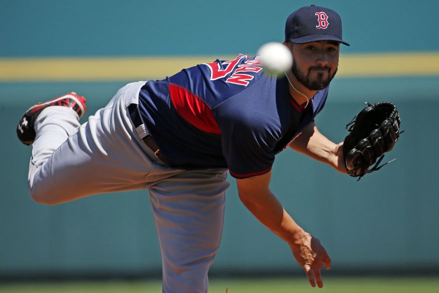 Boston Red Sox pitcher Brandon Workman warms up before the first inning of an exhibition spring training baseball game between the Pittsburgh Pirates and the Boston Red Sox in Bradenton, Fla., Monday, March 3, 2014. The Pirates won 7-6. (AP Photo/Gene J. Puskar)
