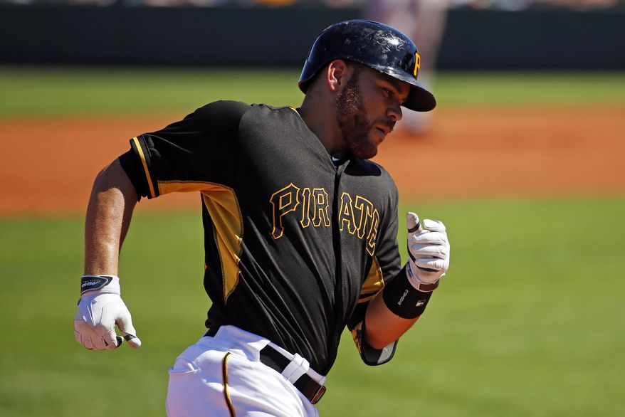 Pittsburgh Pirates' Russell Martin rounds third after hitting a two-run home run off Boston Red Sox pitcher Brandon Workman during the third inning of an exhibition spring training baseball game in Bradenton, Fla., Monday, March 3, 2014. The Pirates won 7-6. (AP Photo/Gene J. Puskar)