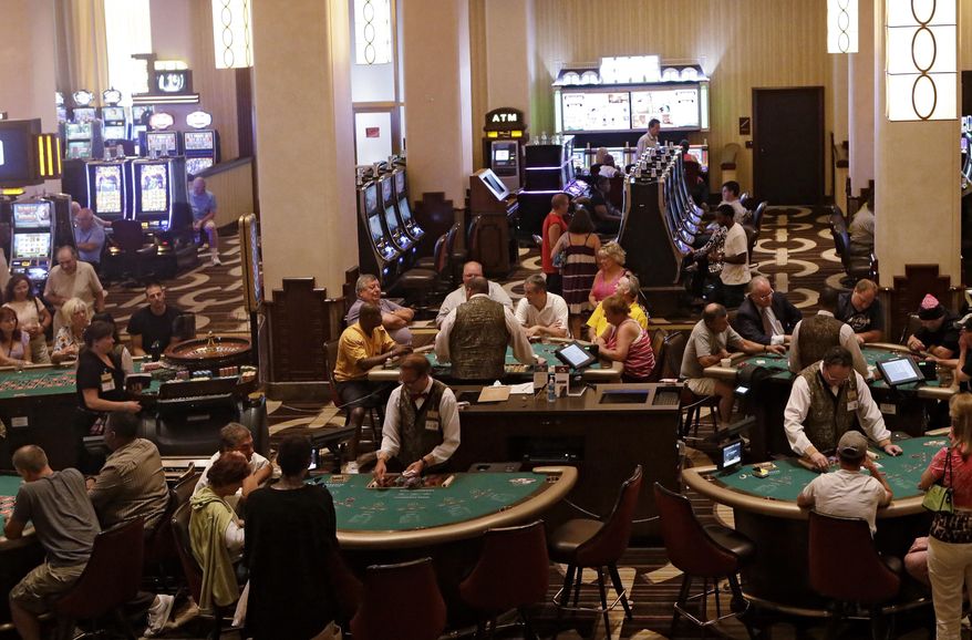 FILE - This June 29, 2012, photo, shows the main gaming floor at the Horseshoe Casino in Cleveland. If current revenues hold through March, the four voter-approved casinos in Ohio will be on track for revenues of nearly $900 million during the first full year they've all been operating. (AP Photo/Mark Duncan)