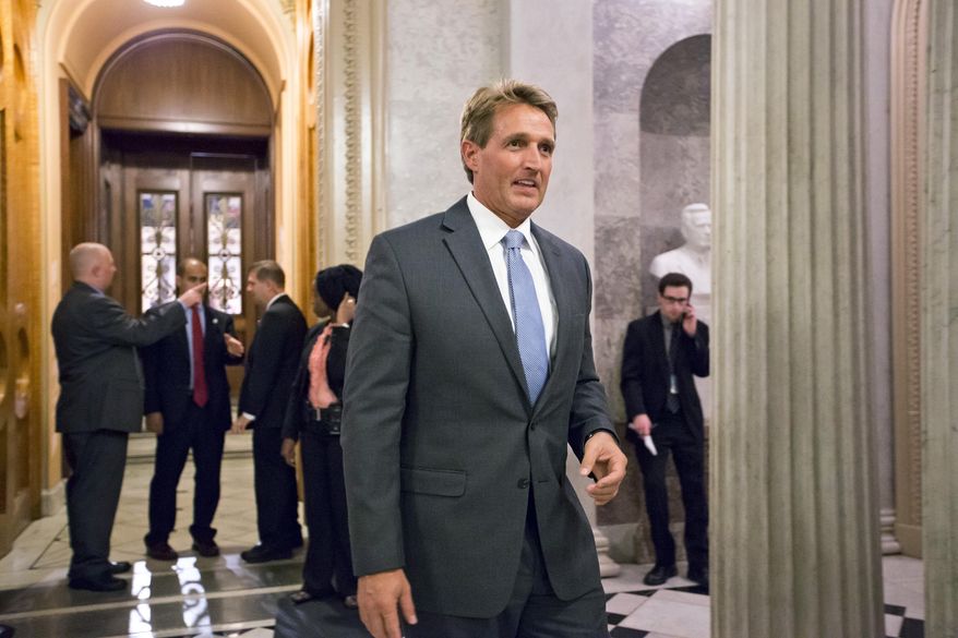 Sen. Jeff Flake, Arizona Republican, leaves the Senate Chamber on Sept. 30, 2013. (Associated Press) ** FILE **