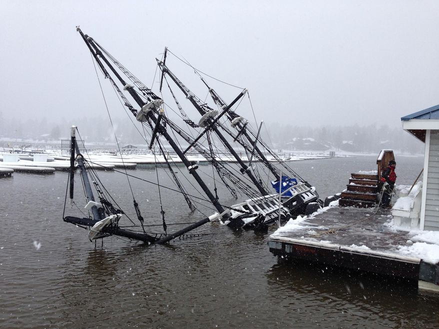 This Saturday, March 1, 2014 photo provided by the Big Bear Visitors Bureau shows a 43-foot pirate ship tour boat partially submerged under water in Big Bear Lake, Calif. The 27-ton boat had been docked at Holloway Marina before sinking. The one-third scale 16th century Spanish galleon replica was a prop in the movie "Time Bandits." (AP Photo/Big Bear Visitors Bureau)