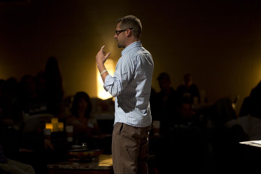 This Nov. 3, 2013 photo, Tige Culbertson speaks during Restoration Fellowship, a fellowship service for people seeking hope healing and growth in an environment free from judgement in Midland, Mich. Restoration Fellowship, a Saturday evening worship group for people struggling with addiction, was founded in October 2011, after Culbertson's own long journey in and out of church. (AP Photo/The Saginaw News, Sammy Jo Hester)