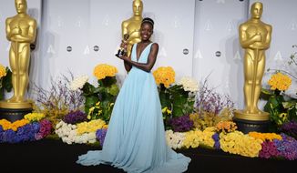 Lupita Nyong&#39;o poses in the press room with the award for best actress in a supporting role for &amp;quot;12 Years a Slave&amp;quot; during the Oscars at the Dolby Theatre on Sunday, March 2, 2014, in Los Angeles.  (Photo by Jordan Strauss/Invision/AP)