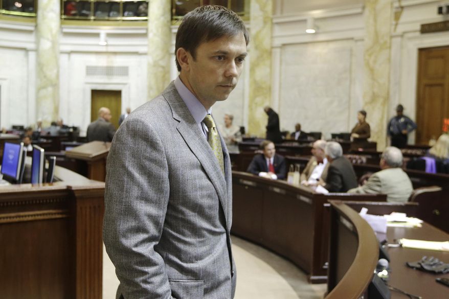 Arkansas House Speaker Davy Carter, R-Cabot, walks through the House chamber at the Arkansas state Capitol in Little Rock, Ark., Monday, March 3, 2014. (AP Photo/Danny Johnston)