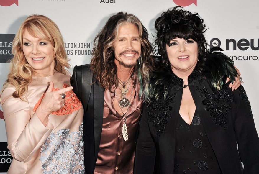 Nancy Wilson, from left, Steven Tyler and Ann Wilson arrive at 2014 Elton John Oscar Viewing and After Party on Sunday, March 2, 2014, in West Hollywood, Calif. (Photo by Richard Shotwell/Invision/AP)