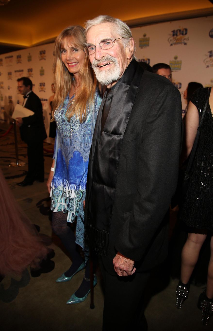 Martin Landau, right, arrives at the 24th Night of 100 Stars Oscars Viewing Gala at The Beverly Hills Hotel on Sunday, March 2, 2014 in Beverly Hills, Calif. (Photo by Annie I. Bang /Invision/AP)