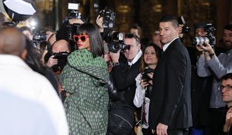 Singer Rihanna arrives at Stella McCartney&#39;s ready-to-wear fall/winter 2014-2015 fashion collection presented in Paris, Monday, March 3, 2014. (AP Photo/Jacques Brinon)