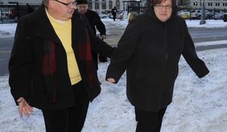 Jayne Rowse and April DeBoer walk outside Federal Courthouse before a trial that could overturn Michigan&#39;s ban on gay marriage in Detroit on Monday, March 3, 2014 in Detroit.  Lisa Brown of Oakland County, the elected clerk of a Detroit-area county says she&#39;ll follow the orders of a judge when it comes to same-sex marriage, not Michigan&#39;s attorney general.  Brown was asked about an email last fall from the attorney general&#39;s office, which warned county clerks not to issue marriage licenses to same-sex couples, even if a judge threw out the ban. Michigan voters banned gay marriage in 2004. In a lawsuit, Detroit-area nurses April DeBoer and Jayne Rowse say that violates the U.S. Constitution.  (AP Photo/Detroit News, David Coates)  DETROIT FREE PRESS OUT; HUFFINGTON POST OUT