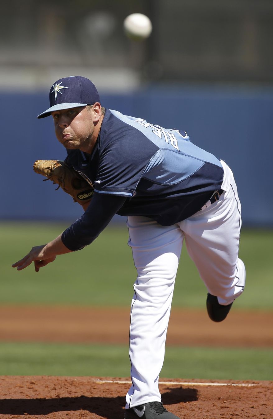 Tampa Bay Rays pitcher C.J. Riefenhauser delivers a warm-up throw in the second inning an exhibition baseball game against the Philadelphia Phillies, Monday, March 3, 2014, in Port Charlotte, Fla. (AP Photo/Steven Senne)